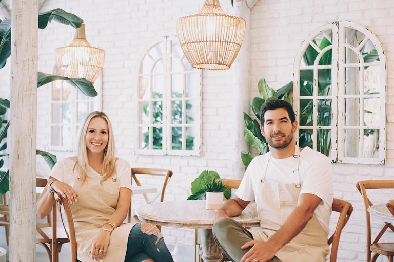 Couple sitting across from eachother in restaurant