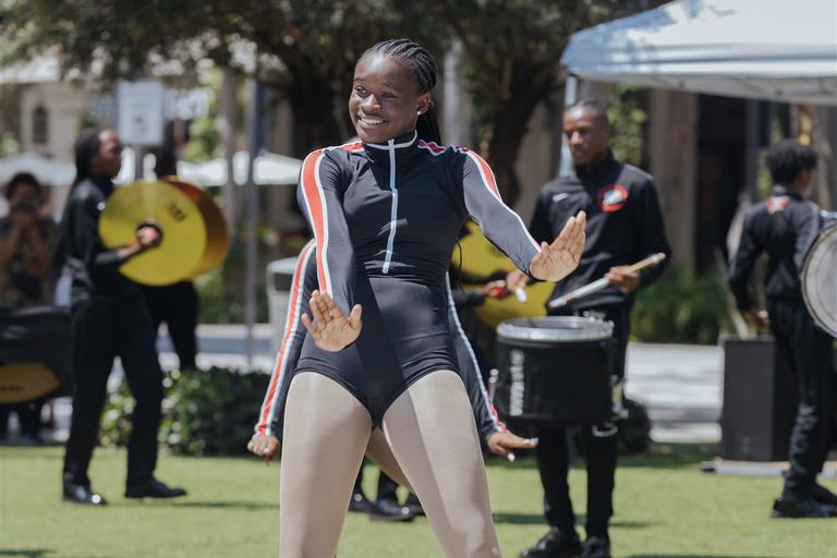 Dancer Leading marching band on the lawn