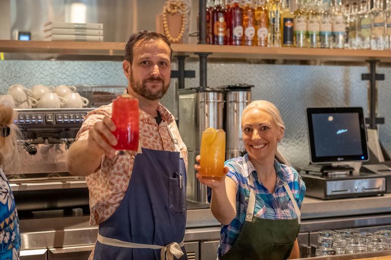 Man and woman holding a drink in their hands